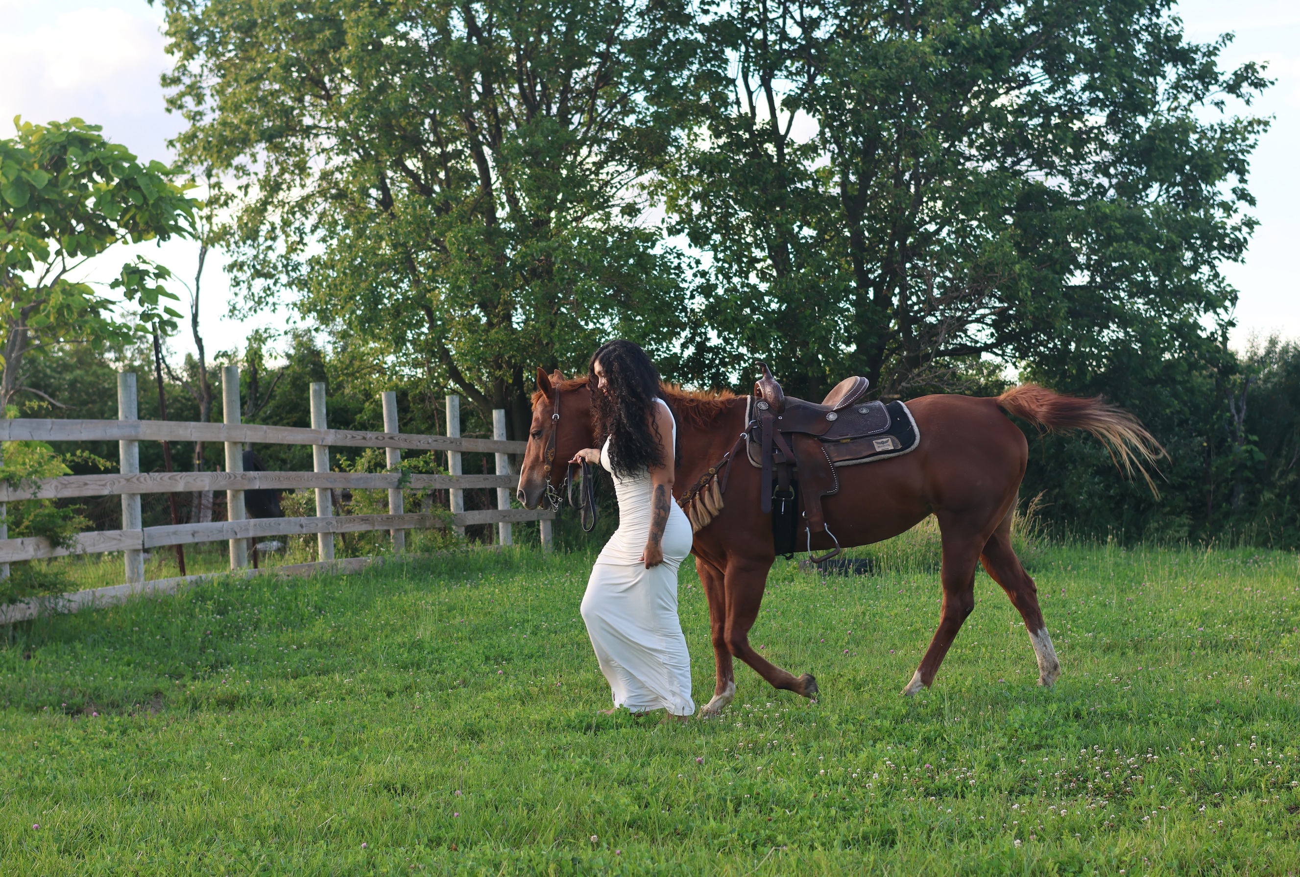 Young girl experiencing her first horse riding lesson